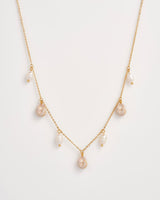 Sea Snail Charm & Pearl Worn Gold Necklace